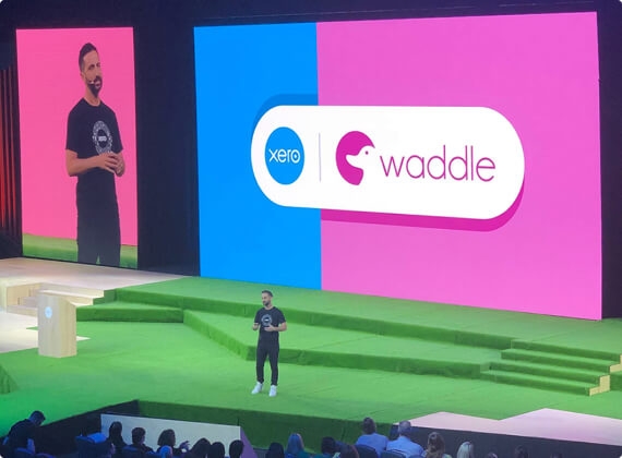 Photo of Waddle, a fintech startup, on stage at Xerocon